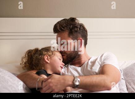 Showering his little one with endless love. a father and daughter bonding together at home Stock Photo