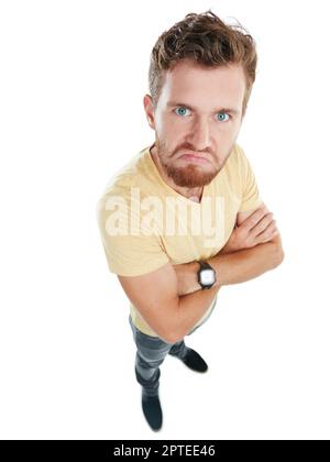 Ive had just about enough of this. Studio portrait of an angry young man standing with his arms folded against a white background Stock Photo