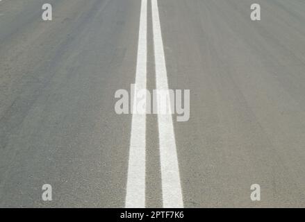 Markings on the road - The double solid line Stock Photo