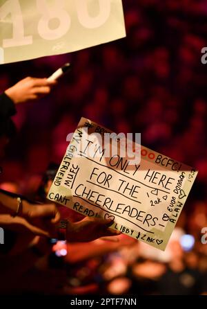 A darts fan holds up a sign ahead of the Paddy Power World Darts ...