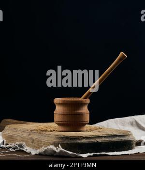 Empty brown plates and wooden spoon on a wooden table Stock Photo