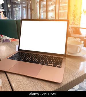 Mock up of generic laptop computer with blank copy space screen for your text or advertising content. Workspace of young freelancer: open notebook pc, Stock Photo