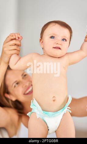 Small steps towards big adventures. a mother playing with her adorable baby girl Stock Photo