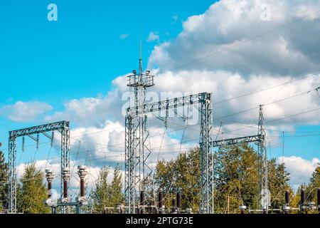 Three phase Electric Power high volt transformer in substation. Part of high-voltage substation with switches and disconnectors. Stock Photo
