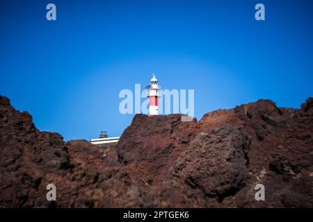 A lighthouse of the cape Teno. Tenerife. Canary Islands. Spain. Art lens. Swirl bokeh. Focus on the center. Stock Photo