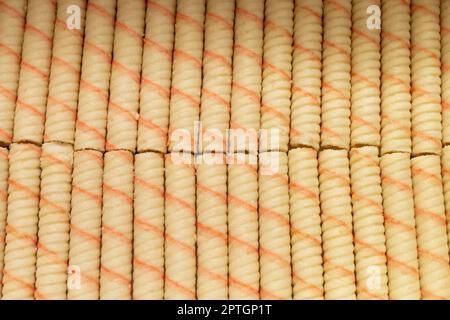 Sweet sticks with stuffing wrapped in a roll . Top view of dessert. Food close-up. Stock Photo