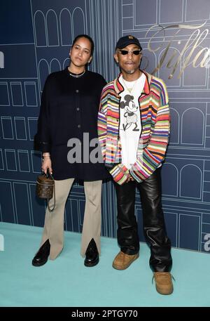 Pharrell Williams, right, and wife Helen Williams attend the