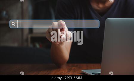 man hand searching browsing for information internet data Technology on computer keyboard notebook.SEO Search Engine Optimization. Stock Photo