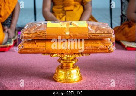 set of monk's robes placed on the pedestal Stock Photo