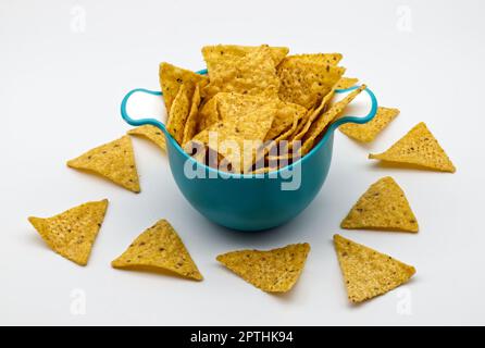 Nachos in a plastic bowl. Tortilla chips isolated on white background. Stock Photo