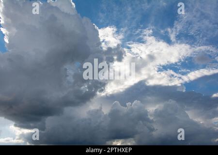 Bright and Dark clouds on the blue sky Stock Photo
