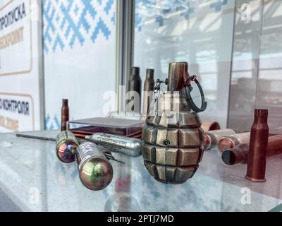 souvenir grenade. toy for children and adults. list of prohibited items at the airport. weapons display stand. Stock Photo