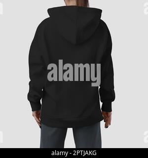 Mockup of a quality long black hoodie on a girl, back view, fashionable apparel for design, brand, product photography for commerce. Streetwear templa Stock Photo