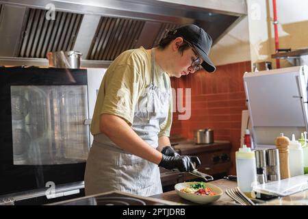 Food prep - Parmesan cheese & grater in a restaurant kitchen Stock Photo -  Alamy