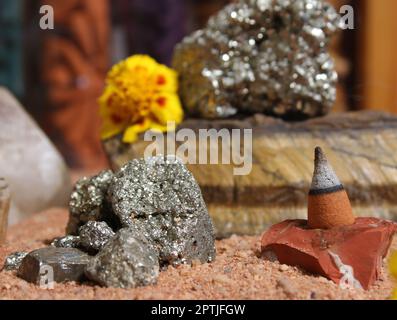 Yellow Flowers With Pyrite Rocks and Crystals on Australian Red Sand Stock Photo