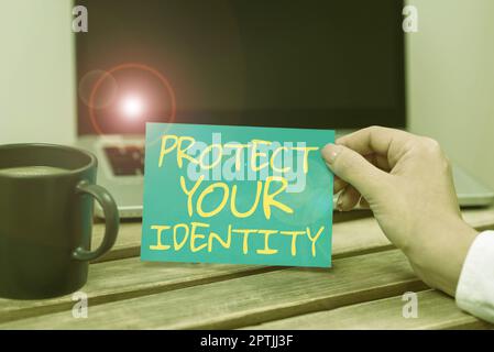 Writing displaying text Protect Your Identity, Concept meaning secure from data breach and information security Stock Photo