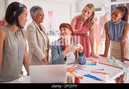 Fashion designer, women diversity and teamwork collaboration with laptop, paper design or color pattern. Smile, happy and talking creative seamstress Stock Photo