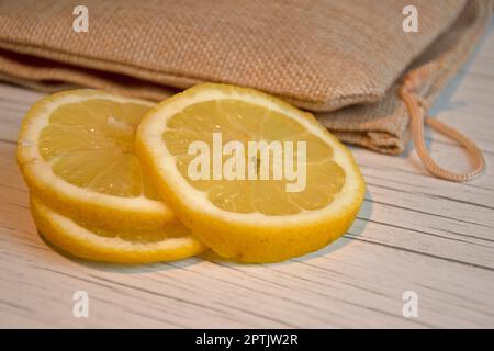 Close up of lemon slices, hessian bagClosed sign on door of restaurant, cornovirus, uk Stock Photo