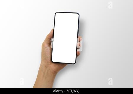 Close up of hand holding smartphone with white screen, Isolated on white background. Stock Photo