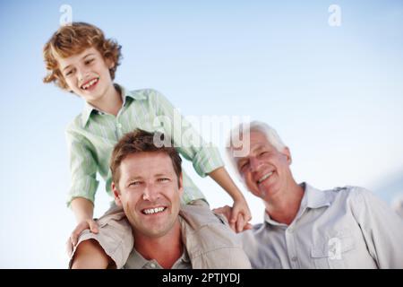 Just one of the guys. Cropped portrait of a young boy with his father and grandfather Stock Photo