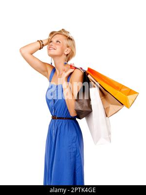 When the going gets tough, the tough go shopping. An attractive young woman holding a bunch of shopping bags Stock Photo