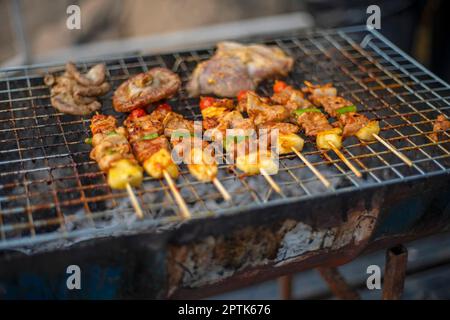 Grilled meat scorched on the grill, burnt Stock Photo - Alamy