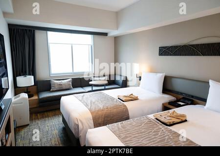 April 26, 2023, Tokyo, Japan: A general view of a Superior Twin guest room of the Hotel Villa Fontaine Grand, part of the new mix-use complex (Haneda Airport Garden), located in front of Haneda Airport Int. Terminal 3. The Haneda Airport Garden complex has finally opened after a three-year delay caused by the pandemic. The complex includes a 1,717-room airport hotel with a natural hot spring spa, MICE-ready event space and meeting rooms that aim to strengthen Haneda Airport's position as a 24-hour international hub airport. Additionally, the complex has around 80 commercial establishments that Stock Photo
