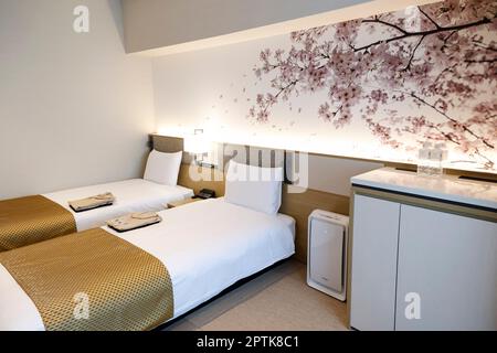 April 26, 2023, Tokyo, Japan: A general view of a Japanese-Western Style Deluxe guest room of the Hotel Villa Fontaine Grand, part of the new mix-use complex (Haneda Airport Garden), located in front of Haneda Airport Int. Terminal 3. The Haneda Airport Garden complex has finally opened after a three-year delay caused by the pandemic. The complex includes a 1,717-room airport hotel with a natural hot spring spa, MICE-ready event space and meeting rooms that aim to strengthen Haneda Airport's position as a 24-hour international hub airport. Additionally, the complex has around 80 commercial est Stock Photo
