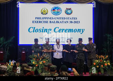 April 28, 2023, Quezon City, Metro Manila, The Philippines: The Philippines Secretary of National Defence DELFIN LORENZANA (3rd Left), U.S. Ambassador MARYKAY L. CARLSON (1st Right) as well as other military officers from the two countries pose for a photo, during the closing ceremony of the US-Philippines Balikatan Exercises at a military base in Quezon City. The month-long bilateral exercises which started in April involved soldiers from both the United States and The Philippines holding live-fire training, with observers from Japan, Australia and more to learn more about their military capa Stock Photo