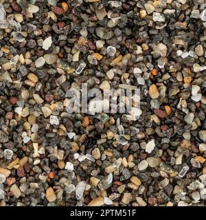 Sea sand with dark volcanic particles, microscope photo made into seamless tileable pattern texture Stock Photo