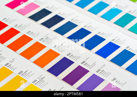 Vibrant colors swatches - adhesive film - with colour names in English, German, French, Polish and Russian, closeup detail Stock Photo