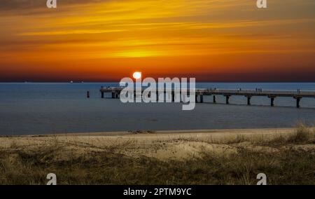 sunset over the baltic sea with bridge Stock Photo