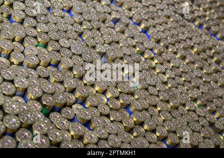 Pattern of 12 gauge cartridges for shotgun bullets. Shells for hunting rifle close up. Backdrop for shooting range or ammunition trade concepts. Used Stock Photo