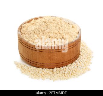 Sesame flour in wooden bowl isolated on white Stock Photo