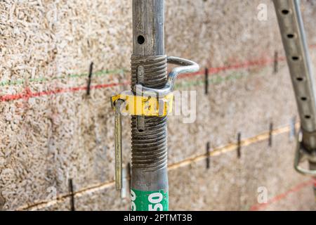 Scaffolding pipe clamp and parts, an important part of building strength to scaffold clamps in used close up on construction site,platforms for stage Stock Photo