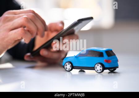 Buy And Sell Car Insurance Online On Phone Stock Photo