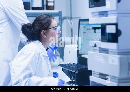Young scientists working in a laboratory, Freiburg Im Breisgau, Baden-wuerttemberg, Germany Stock Photo