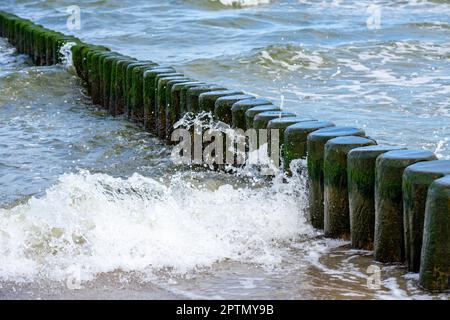 Waves break at a groyne on the Baltic Sea on Usedom Stock Photo