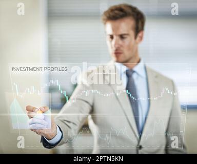 Modern business thrives on technological advancements. a businessman using a digital interface Stock Photo