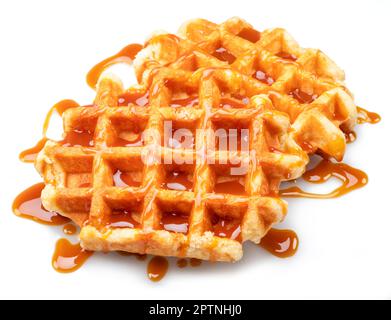 Belgian waffle with caramel topping isolated on white background. Stock Photo