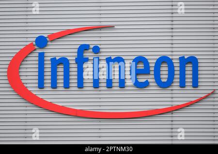 Dresden, Germany. 26th Apr, 2023. The logo of the Infineon chip group is mounted on the facade of the plant. Infineon breaks ground for the new Smart Power Fab in Dresden on May 2, 2023. Credit: Robert Michael/dpa/Alamy Live News Stock Photo