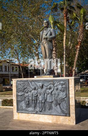 A bronze statue of Mustafa Kamal Ataturk, the founder of modern Turkey stands on a large granite plinth in a square in Side Old Town, in Antalya Provi Stock Photo