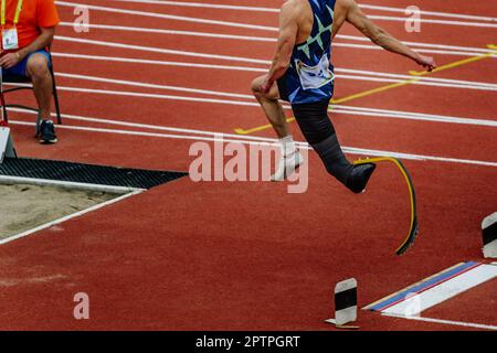 male para athlete on limb deficiency long jump take off board, summer para athletics championships Stock Photo