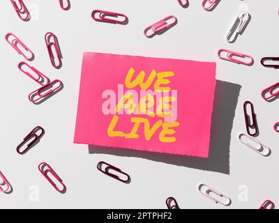 Conceptual caption We Are Live, Business approach continuous report or chat that is streamed in real time Stock Photo