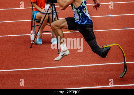 male para jumper on limb deficiency run up long jump, summer para athletics championships, Nike brand running spikes shoes Stock Photo