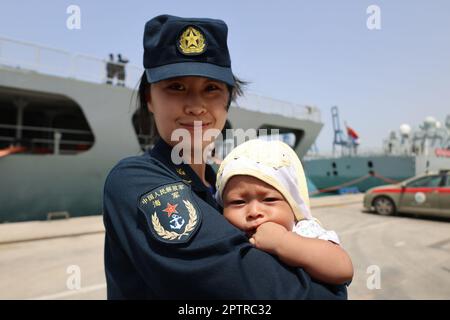 (230428) -- JEDDAH, April 28, 2023 (Xinhua) -- A Chinese navy soldier escorting an infant evacuated from Sudan by Chinese navy vessels arrives at the Saudi Arabian port of Jeddah on April 27, 2023. Two Chinese navy vessels have successfully evacuated a first batch of 678 people from Sudan, who arrived at the Saudi Arabian port of Jeddah at around 3 p.m. Thursday Beijing time, according to an official statement. The Chinese People's Liberation Army (PLA) Navy's guided-missile destroyer Nanning and comprehensive supply ship Weishanhu were dispatched to Sudan on Wednesday Beijing time for emergen Stock Photo