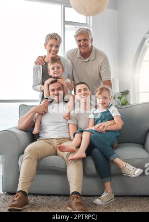 The memories we make with our family is everything. a happy family relaxing on the sofa at home Stock Photo