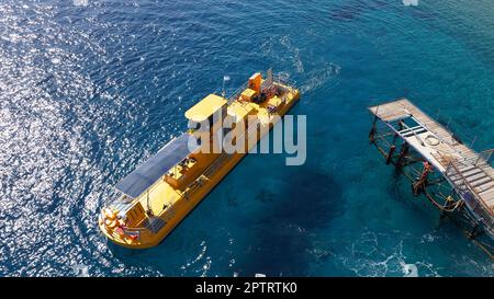 Coral 2000 boat in Coral Beach Nature Reserve . Tourist Yellow boat in Eilat, Israel. Stock Photo