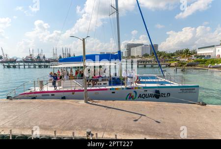 Aquaworld party boat trip with tourists on deck, Puerto Juarez, Cancun, Quintana Roo, Yuucatan Peninsula, Mexico Stock Photo