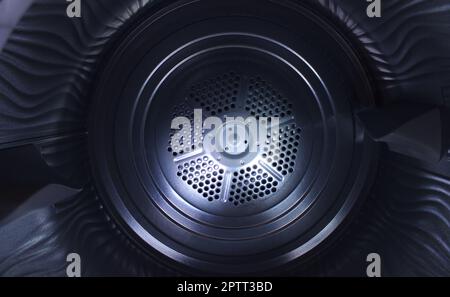 View from inside the clean empty drum of a washing machine Stock Photo